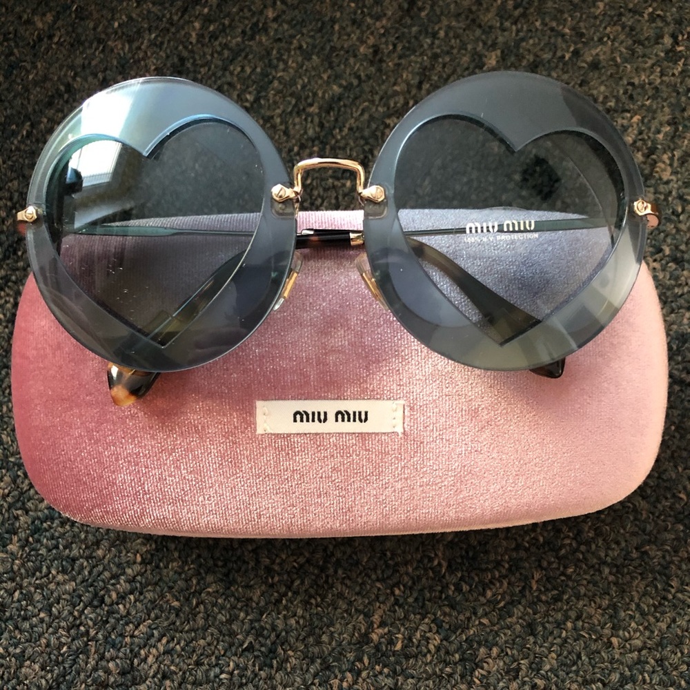 Miu Miu sunglasses with hearts in lenses